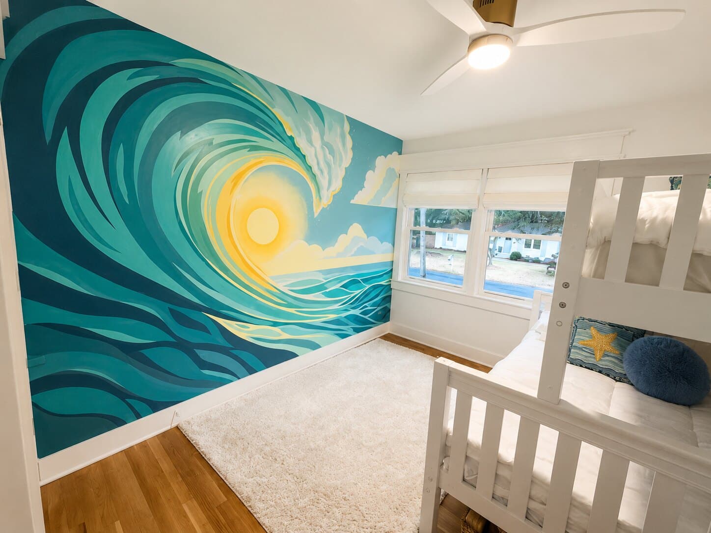 The bunk room's hand-painted wave.
